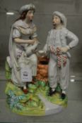 A good Staffordshire group of a Turkish couple by a well.