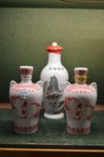 Three bottles of Sake.