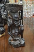 An unusual African carved hardwood figure group.