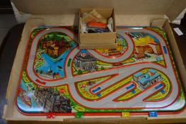 A painted tin plate racing car game, in original box.