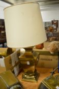 A large brass table lamp.