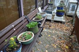 A quantity of glazed garden pots.