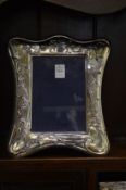 A large silver photograph frame.