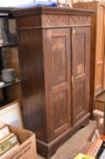 Continental carved oak two door cupboard.