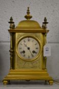 An ormolu mantel clock.