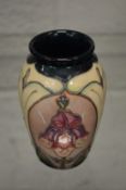 A small Moorcroft vase with original box.