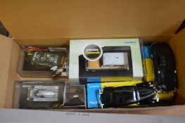 A group of boxed model cars.