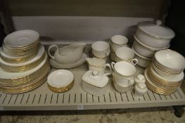 Gilt decorated white porcelain dinnerware, various makers.