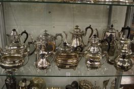 A quantity of plated teapots, coffee pots and related items.