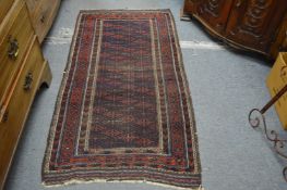 A small Belouch rug 175cm x 90cm.