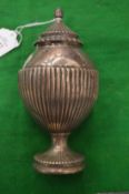 A silver pedestal sugar box with reeded decoration.