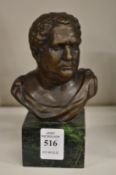 A small bronze bust of a Roman gentleman.