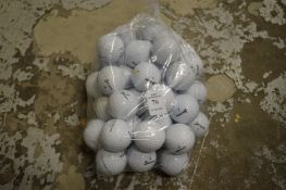 A bag of fifty Srixon golf balls.