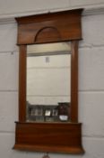 A Continental satin walnut framed mirror.