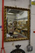 A small gilt framed mirror.