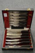 A cased set of steak knives and forks.