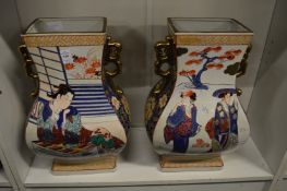 A large pair of Japanese twin handled pottery vases.