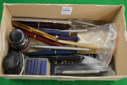 Various pens and accessories.