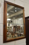 A modern rectangular wall mirror.