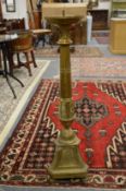 A floor standing brass candlestand.