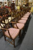 A set of eight Georgian style mahogany dining chairs with Prince of Wales feather backs, two with