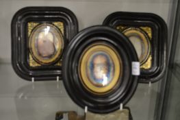 A pair of Victorian ebonised framed early photographs together with a similar oval framed