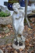 A garden ornament modelled as a classical lady.