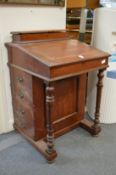A late Victorian walnut davenport.
