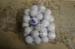 A bag of fifty Titleist golf balls.