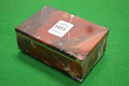 A hardstone box with hinged cover.