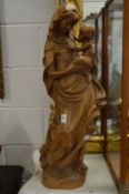 Two large carved wood religious figures.