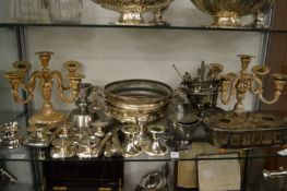 A quantity of plated ware to include a pair of candelabra.