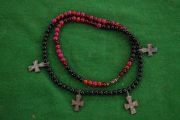 A decorative necklace mounted with crucifixes.