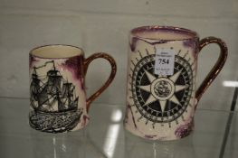 Two lustre ware tankards.