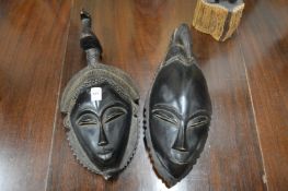 Two African carved wood masks.