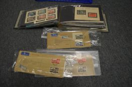 A collection of stamps and stamp albums.