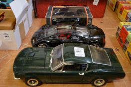 Three large model cars, one boxed.