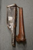 A leg of mutton gun case and another gun case.