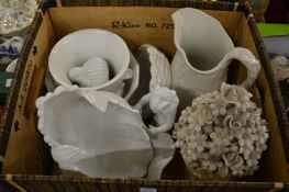 Various white porcelain jugs and ornaments.