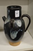 A Chinese pottery ewer.