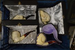 Four cased meerschaum pipes.