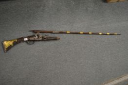 An early Eastern flintlock rifle (faults).