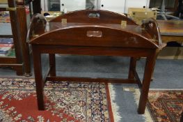 A reproduction mahogany butler's tray and stand.