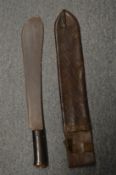 World War II machete with leather scabbard.