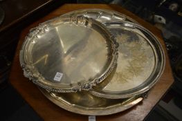 Three large circular plated trays.