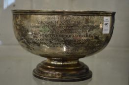 A silver pedestal bowl with presentation inscription.