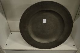 A large pewter charger.