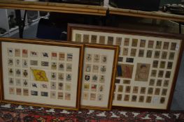 Three framed and glazed displays of silk cigarette cards.