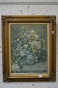 After Renoir, oleographic study of flowers in a vase in a decorative gilt frame.