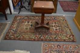 A Caucasian rug (worn). 190cm x 125cm.